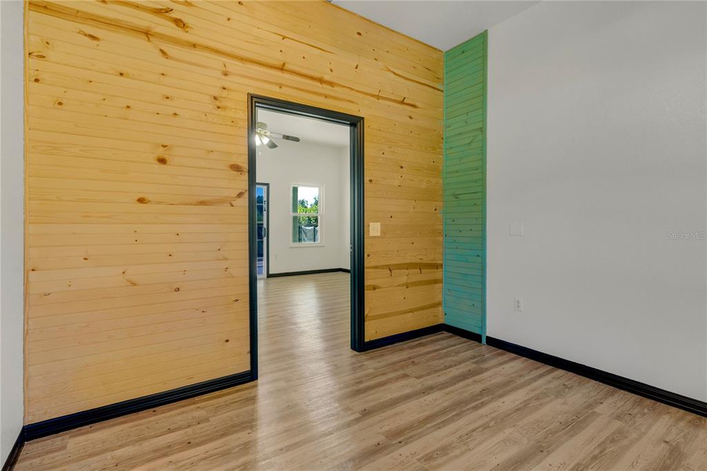 4831 Rummell Road St. Cloud, FL 34771 - Photo 12 of 37 an empty room with wooden floor and closet