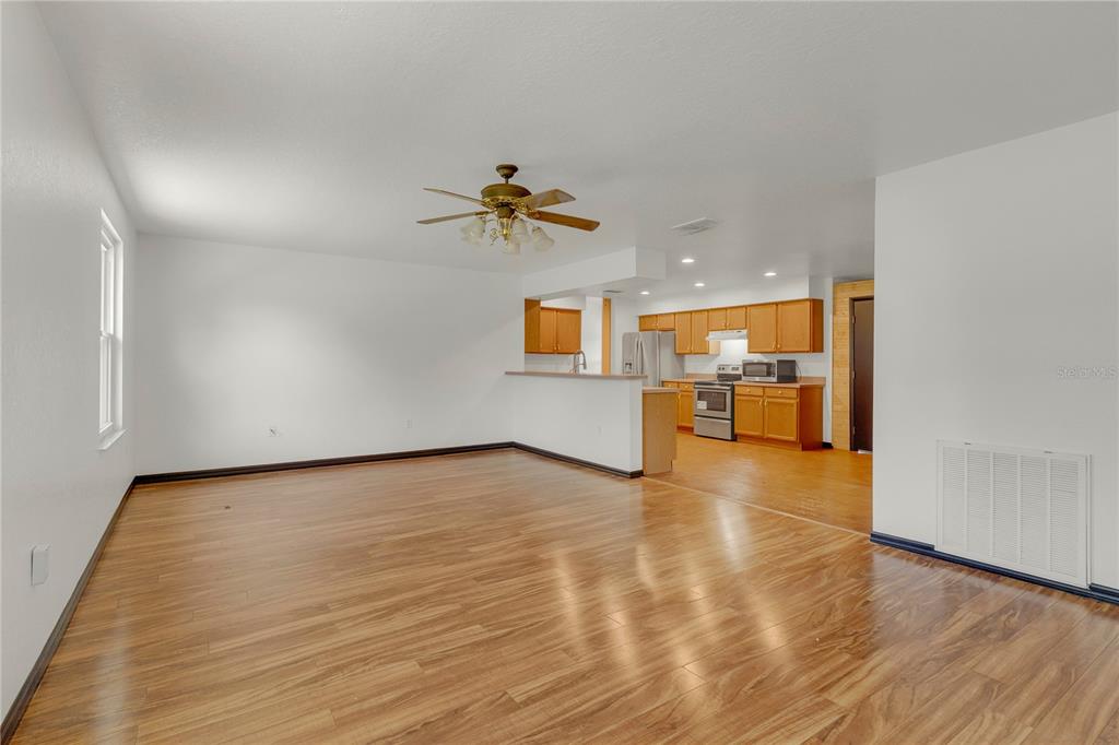 4831 Rummell Road St. Cloud, FL 34771 - Photo 17 of 37 wooden floor in an empty room with a window