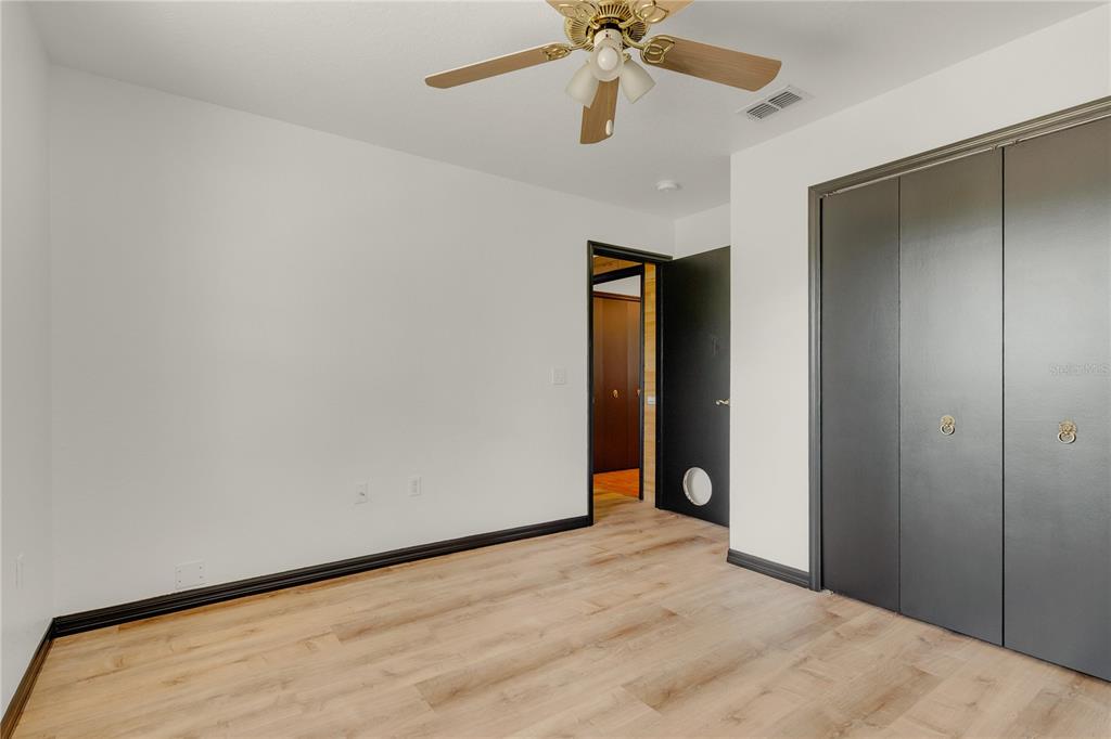 4831 Rummell Road St. Cloud, FL 34771 - Photo 20 of 37 a view of an empty room and chandelier fan