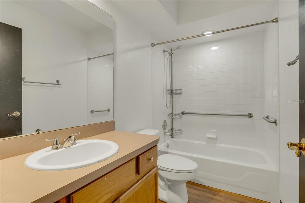 4831 Rummell Road St. Cloud, FL 34771 - Photo 21 of 37 a bathroom with a sink toilet and shower