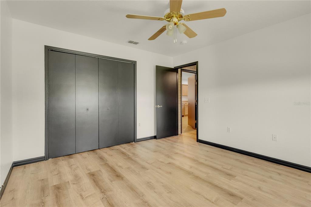 4831 Rummell Road St. Cloud, FL 34771 - Photo 23 of 37 a view of empty room with a ceiling fan