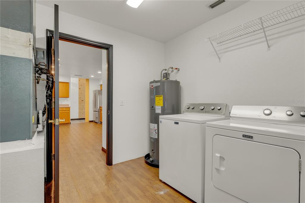 4831 Rummell Road St. Cloud, FL 34771 - Photo 25 of 37 a view of storage room with washer and dryer