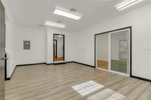 a view of a livingroom with wooden floor and closet