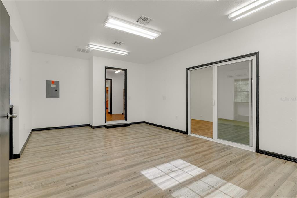 4831 Rummell Road St. Cloud, FL 34771 - Photo 28 of 37 a view of a livingroom with wooden floor and closet