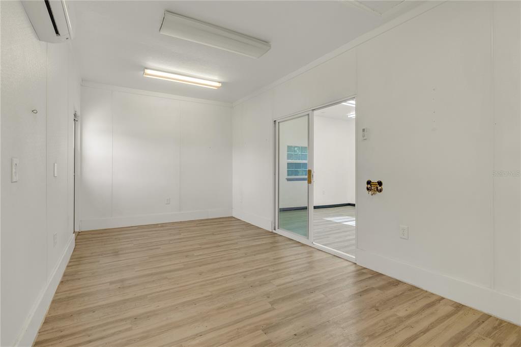 4831 Rummell Road St. Cloud, FL 34771 - Photo 30 of 37 a view of an empty room with wooden floor
