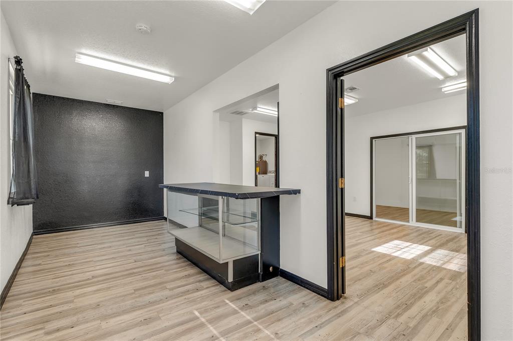 4831 Rummell Road St. Cloud, FL 34771 - Photo 31 of 37 a view of a hallway with wooden floor and staircase
