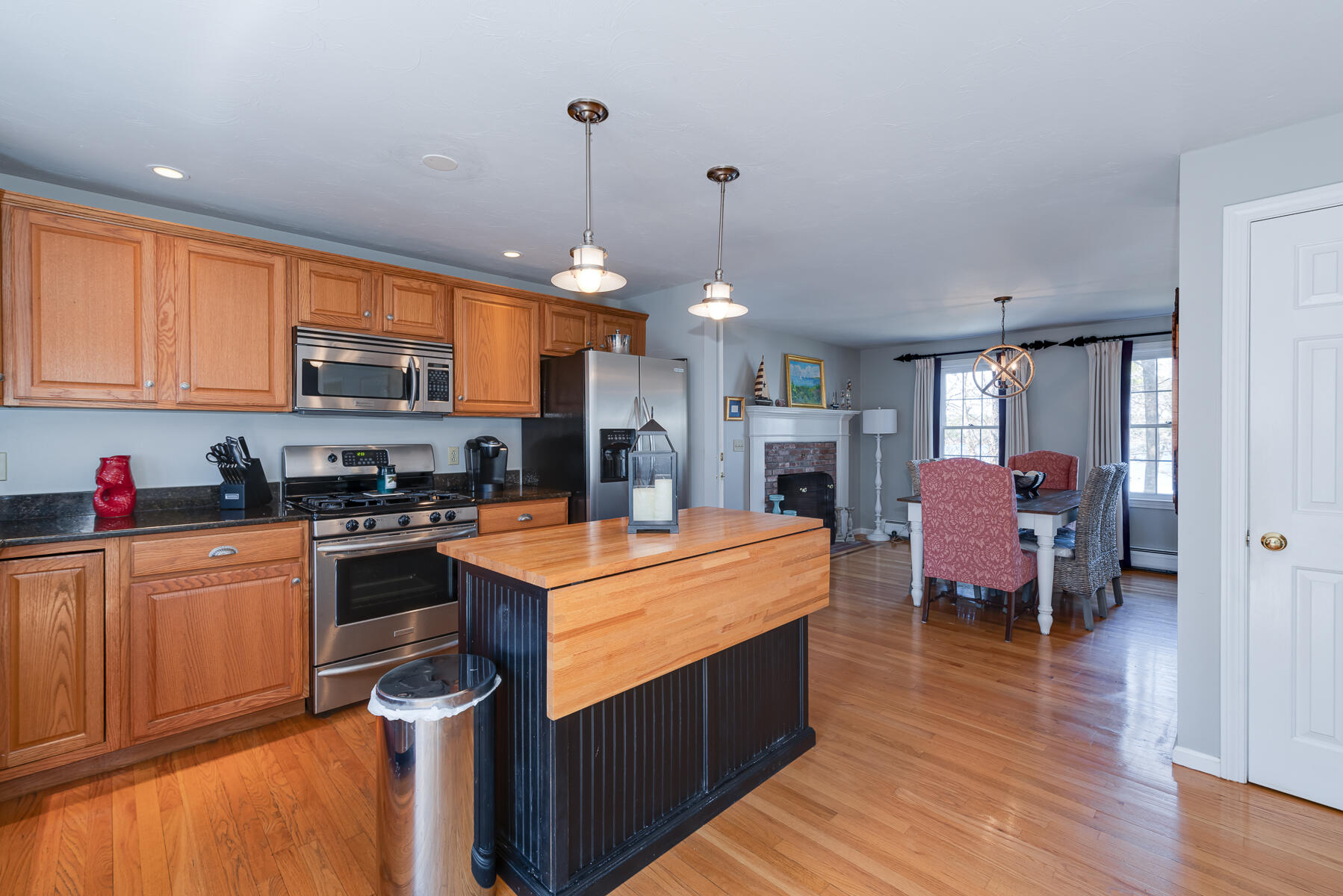 1 Country Farm Road Forestdale, MA 02644 - Photo 15 of 54 a large kitchen with stainless steel appliances granite countertop a stove refrigerator and a view of living room