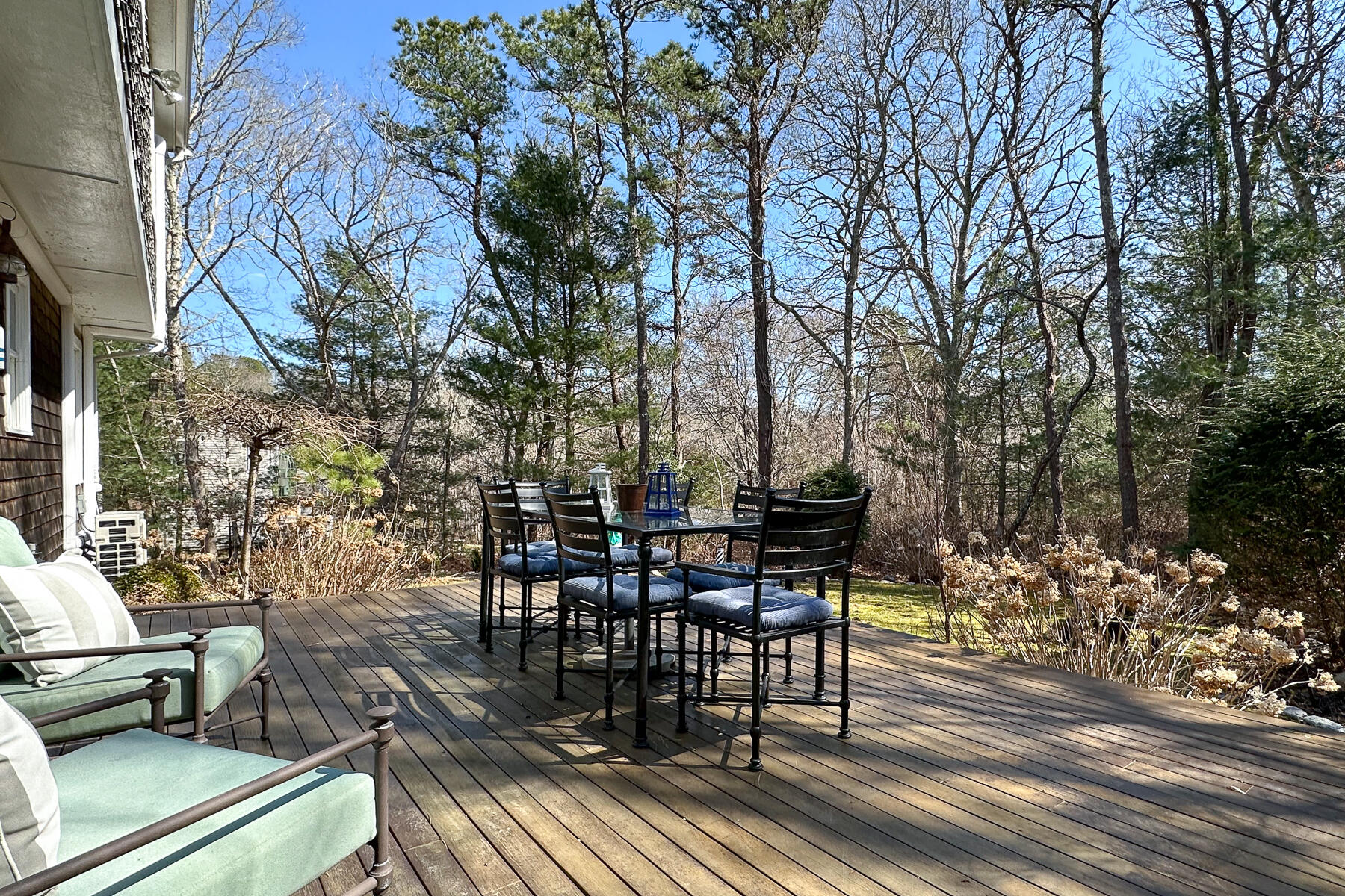 1 Country Farm Road Forestdale, MA 02644 - Photo 41 of 54 a view of a roof deck with table and chairs and wooden floor