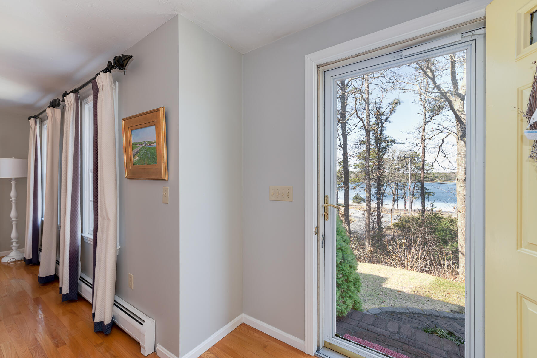 1 Country Farm Road Forestdale, MA 02644 - Photo 6 of 54 a view of a hallway with wooden floor and door