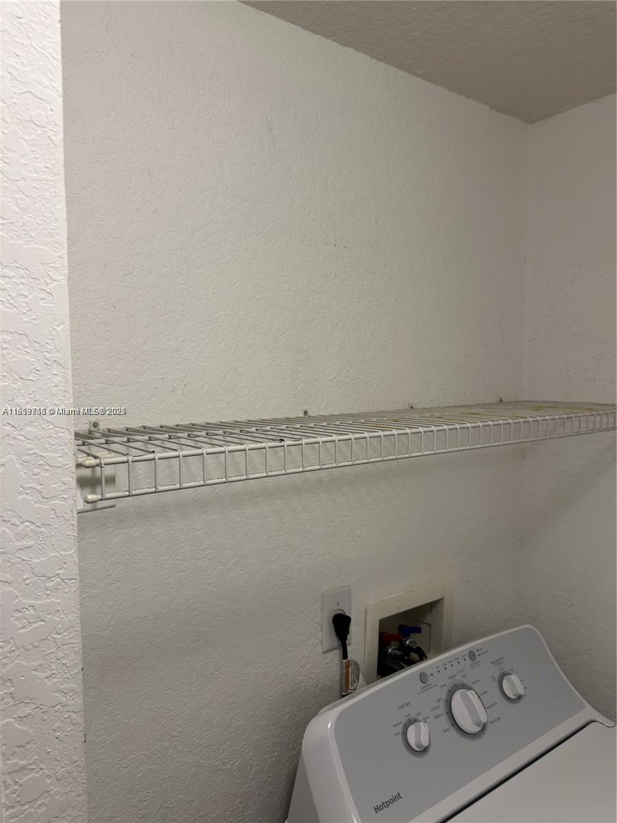 6790 West Sample Road, Unit 6790 Coral Springs, FL 33067 - Photo 16 of 26 a bathroom with a sink and vanity
