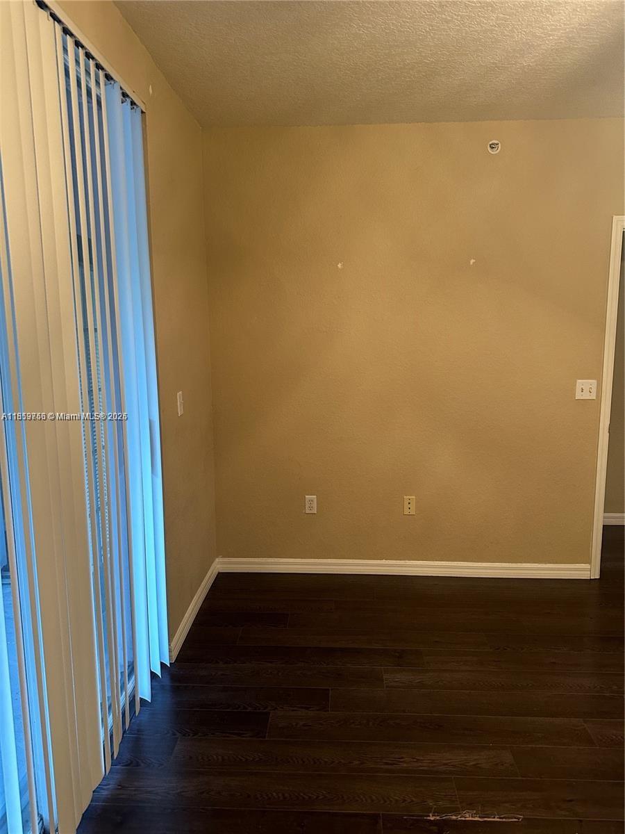 6790 West Sample Road, Unit 6790 Coral Springs, FL 33067 - Photo 17 of 26 a view of wooden floor