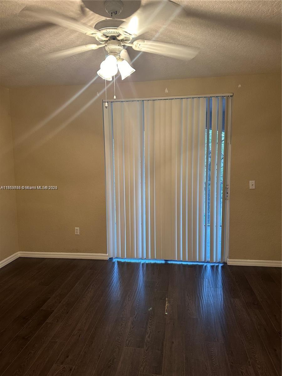 6790 West Sample Road, Unit 6790 Coral Springs, FL 33067 - Photo 23 of 26 a view of a livingroom with wooden floor