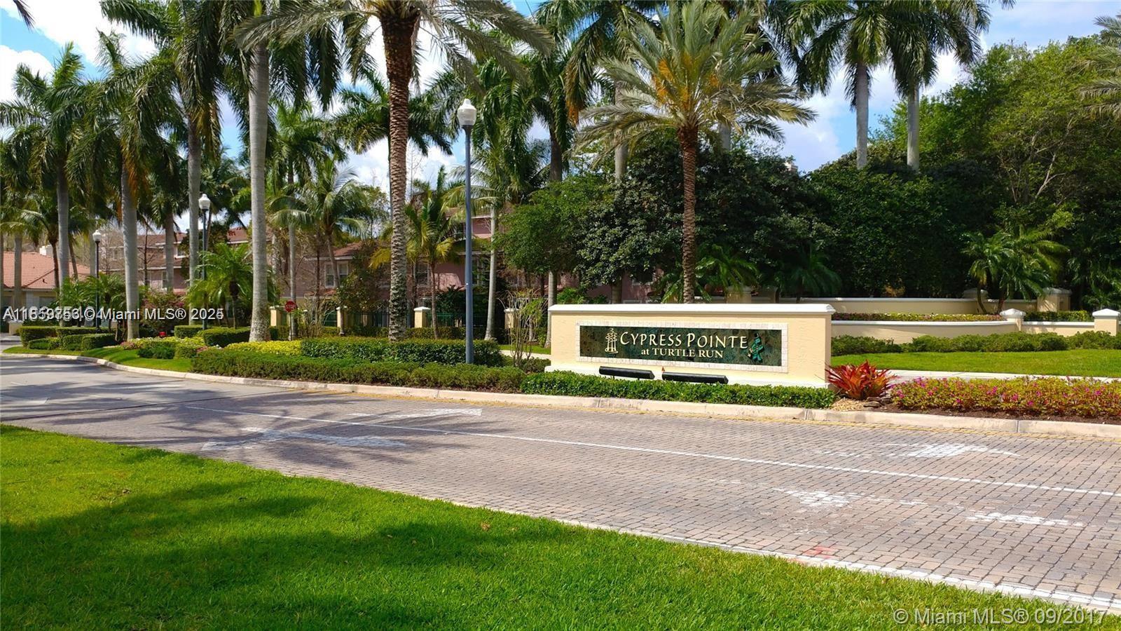 6790 West Sample Road, Unit 6790 Coral Springs, FL 33067 - Photo 26 of 26 a view of road with trees and a big yard