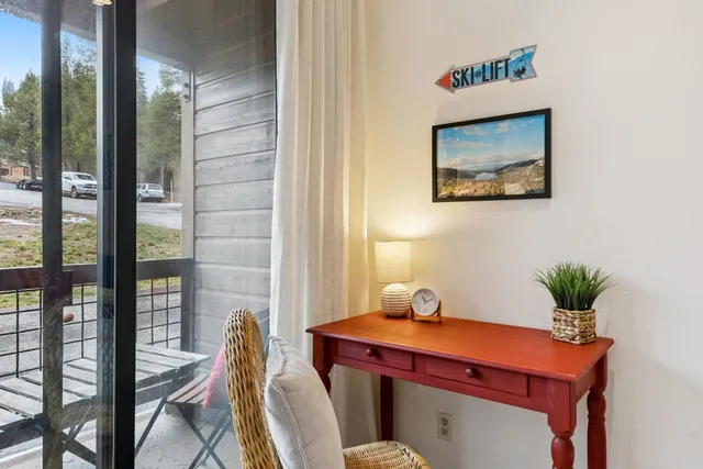 a dining room with furniture and wooden floor