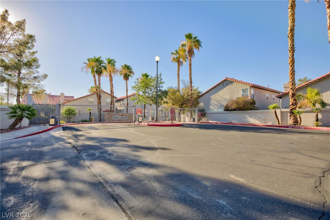 2246 Ramsgate Drive Henderson, NV 89074 - Photo 31 of 36 Secure community entrance with towering palm trees welcomes you home.