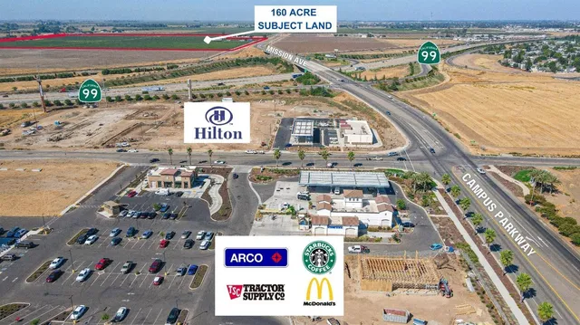 a view of a field with an ocean view