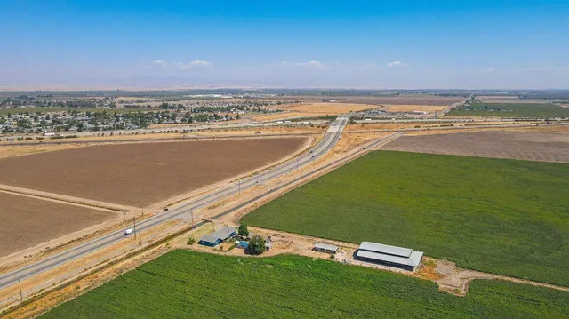 a view of a road with an ocean view
