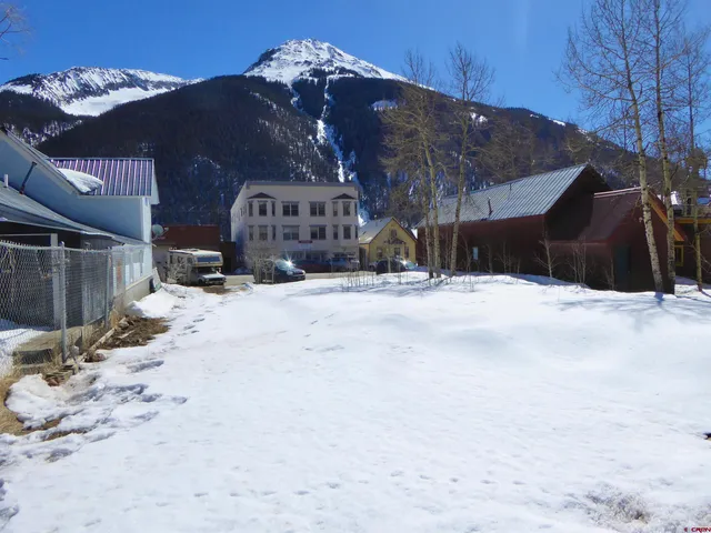 a view of city street with a house