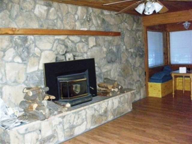 2727 High Ridge Road Overgaard, AZ 85933 - Photo 4 of 5 a living room with furniture and a fireplace