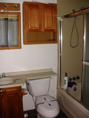 2727 High Ridge Road Overgaard, AZ 85933 - Photo 5 of 5 a bathroom with a toilet a sink and a shower