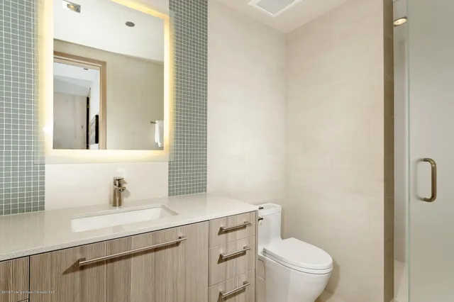 a bathroom with a sink and a cabinets