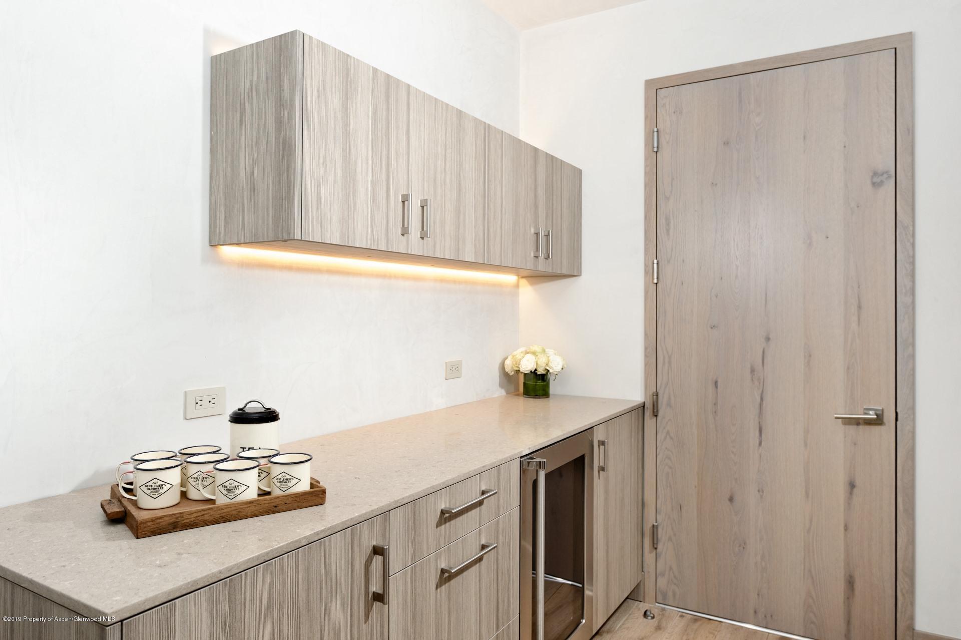 217 South 3rd Street Aspen, CO 81611 - Photo 22 of 32 a bathroom with a sink and a cabinets