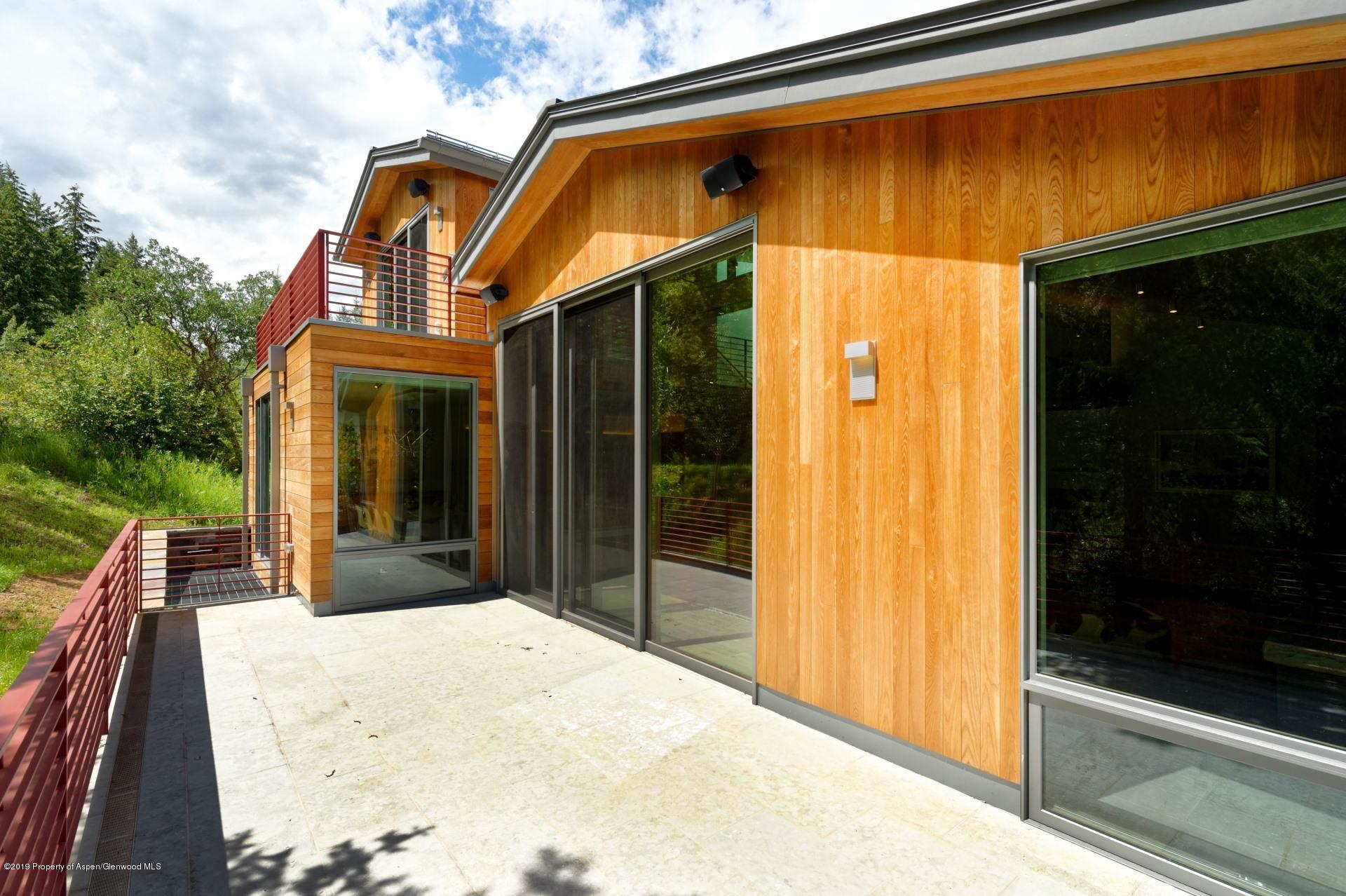 217 South 3rd Street Aspen, CO 81611 - Photo 30 of 32 a view of a house with backyard and trees