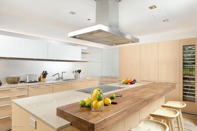 a view of a kitchen and dining room