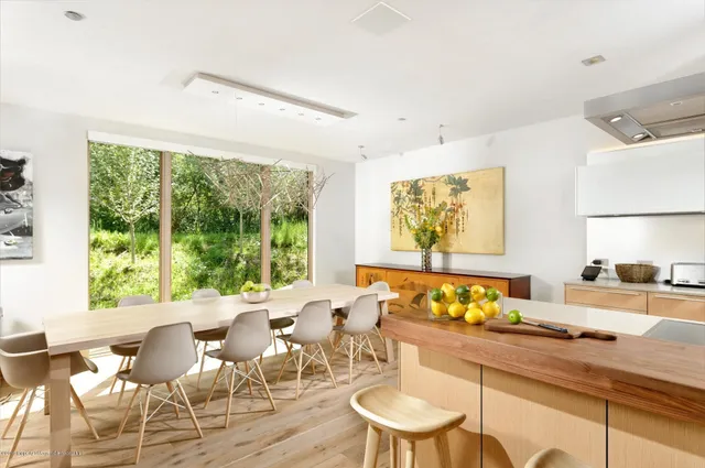 a bedroom with a large bed and a fireplace