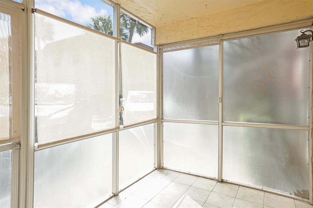 101 East McNab Road, Unit 112 Pompano Beach, FL 33060 - Photo 11 of 27 Privacy shades on patio