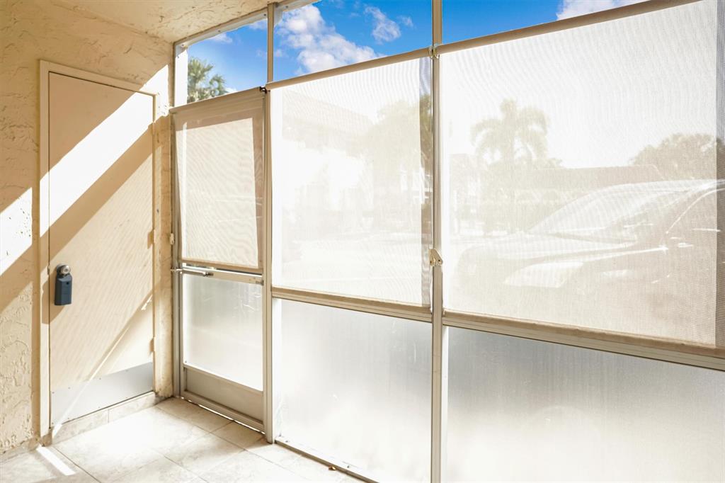 101 East McNab Road, Unit 112 Pompano Beach, FL 33060 - Photo 12 of 27 Privacy shades on patio