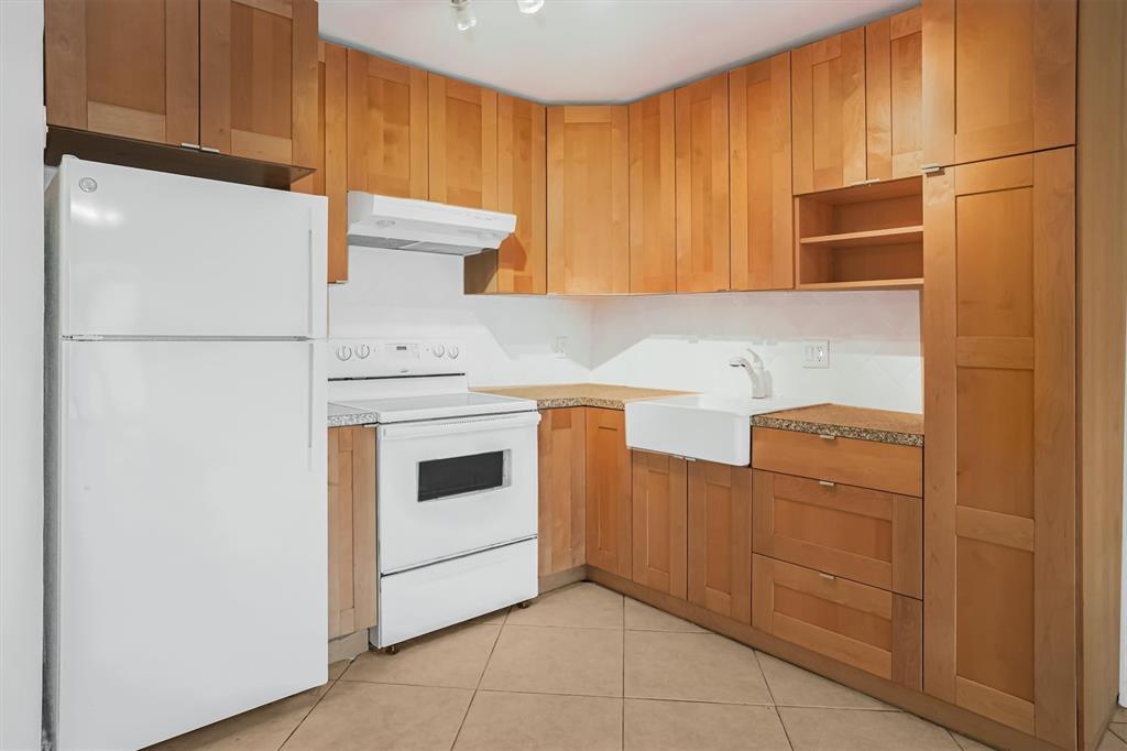 101 East McNab Road, Unit 112 Pompano Beach, FL 33060 - Photo 5 of 27 kitchen with pull out pantry drawers