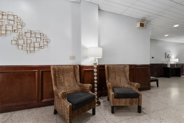 a view of a building with sitting area