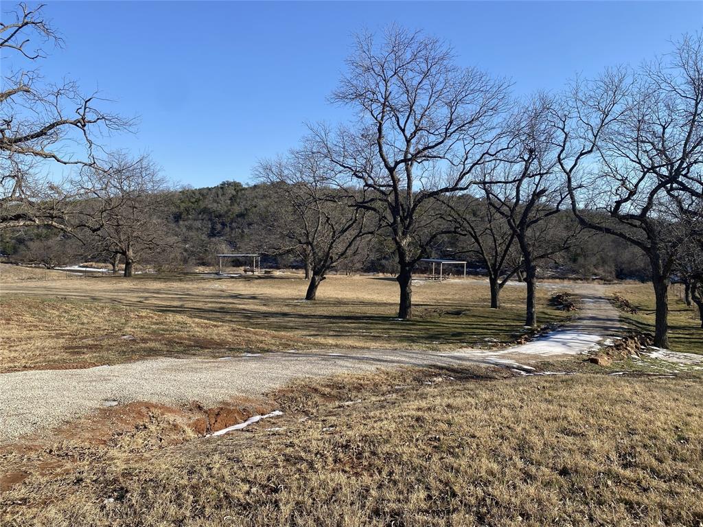 Lot 133 River Shoals Weatherford, TX 76088 - Photo 13 of 20 a view of a yard with a tree
