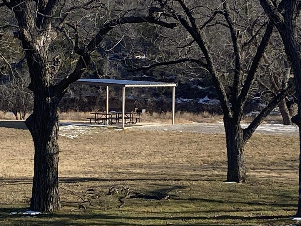 Lot 133 River Shoals Weatherford, TX 76088 - Photo 15 of 20 a backyard of a house with yard table and chairs