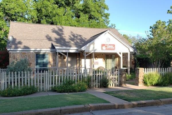 Lot 133 River Shoals Weatherford, TX 76088 - Photo 17 of 20 a view of a house with a small yard and plants