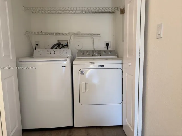 a utility room with dryer and washer