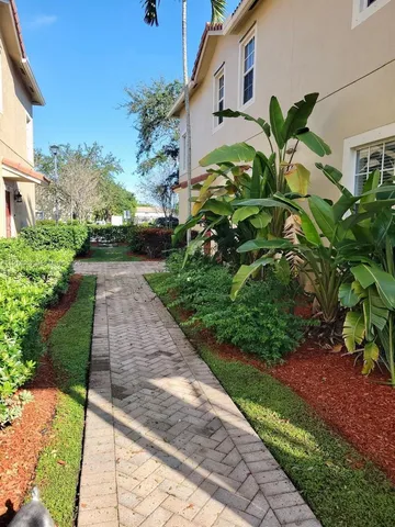 a view of swimming pool with a table and chairs