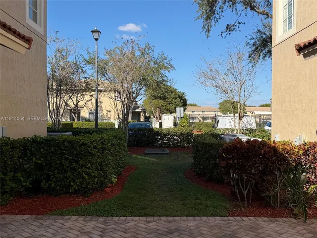 a view of a house with a garden