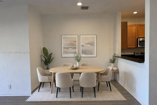 a view of a dining room with furniture and window