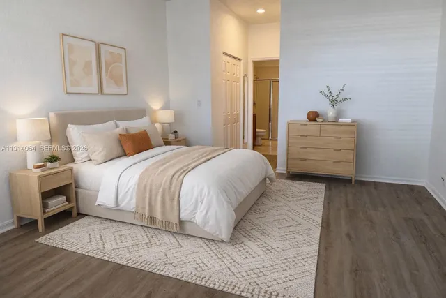 a bedroom with a bed and a dresser