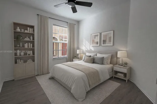 a bedroom with a large bed and a window