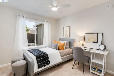 a bedroom with a bed and a table in it