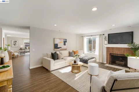 a living room with furniture fireplace and a flat screen tv