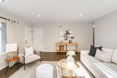 a living room with furniture and a couch