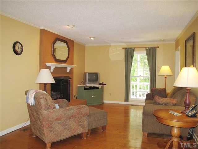 901 Skinners Ridge Road Raleigh, NC 27614 - Photo 3 of 14 a living room with furniture a window and a lamp