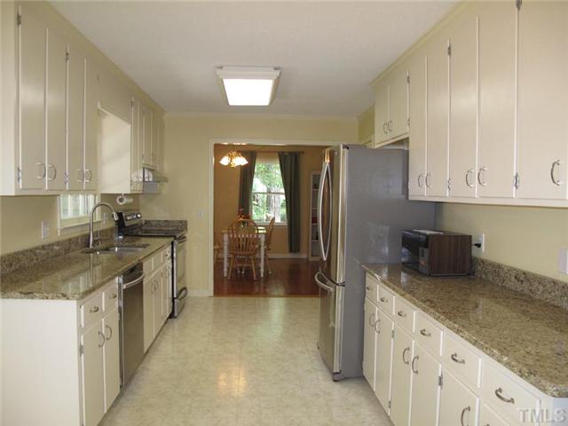 901 Skinners Ridge Road Raleigh, NC 27614 - Photo 5 of 14 a kitchen with stainless steel appliances granite countertop a refrigerator and a sink