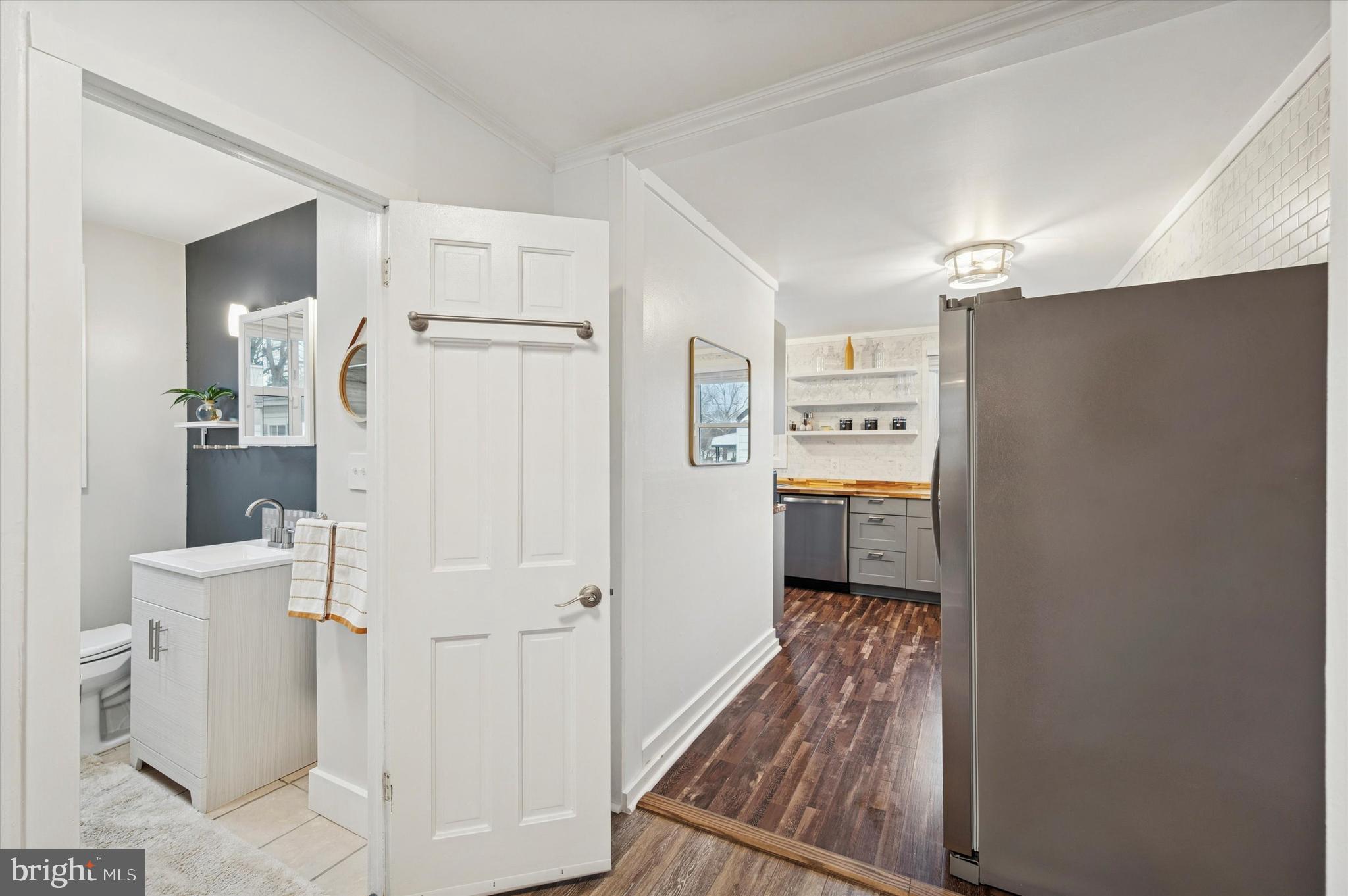 508 5th Avenue Barrington, NJ 08007 - Photo 13 of 28 a view of a hallway with bathroom and wooden floor