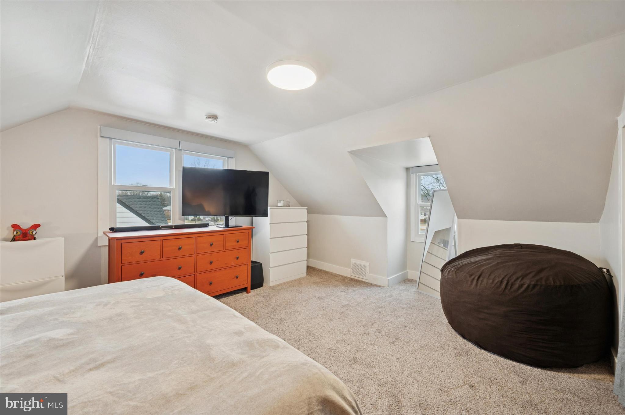 508 5th Avenue Barrington, NJ 08007 - Photo 22 of 28 a bedroom with a bed and flat screen tv