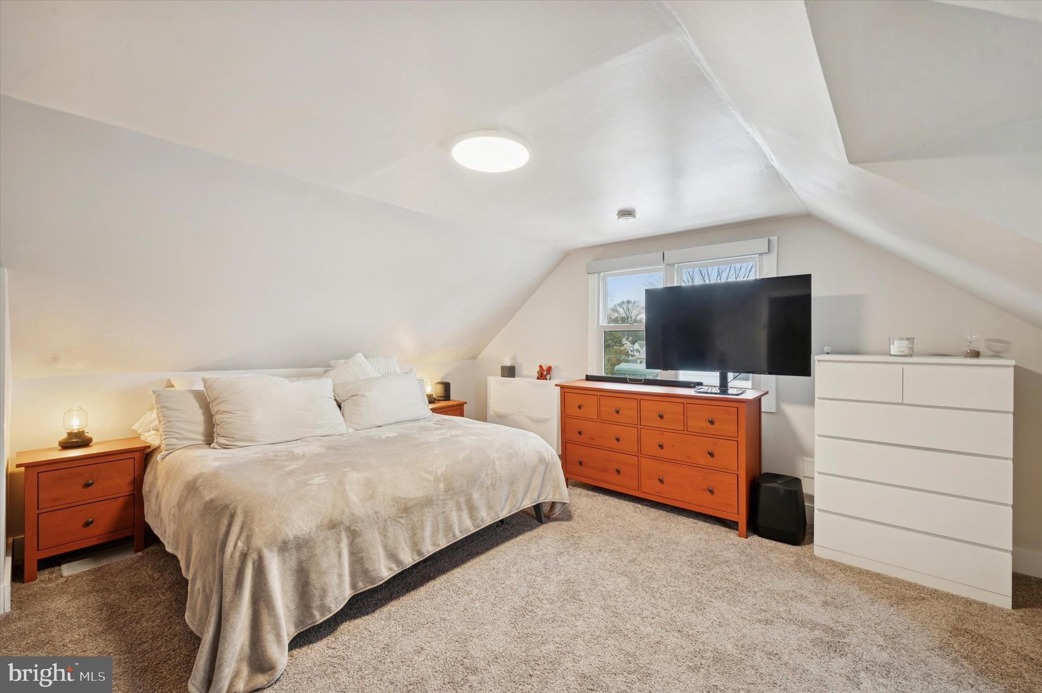 508 5th Avenue Barrington, NJ 08007 - Photo 23 of 28 a bedroom with a bed and a dresser